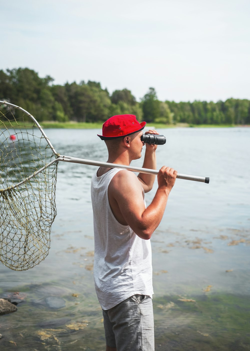 man holding fish net