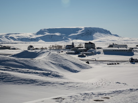 ray building near white snowfield in Mývatn Iceland