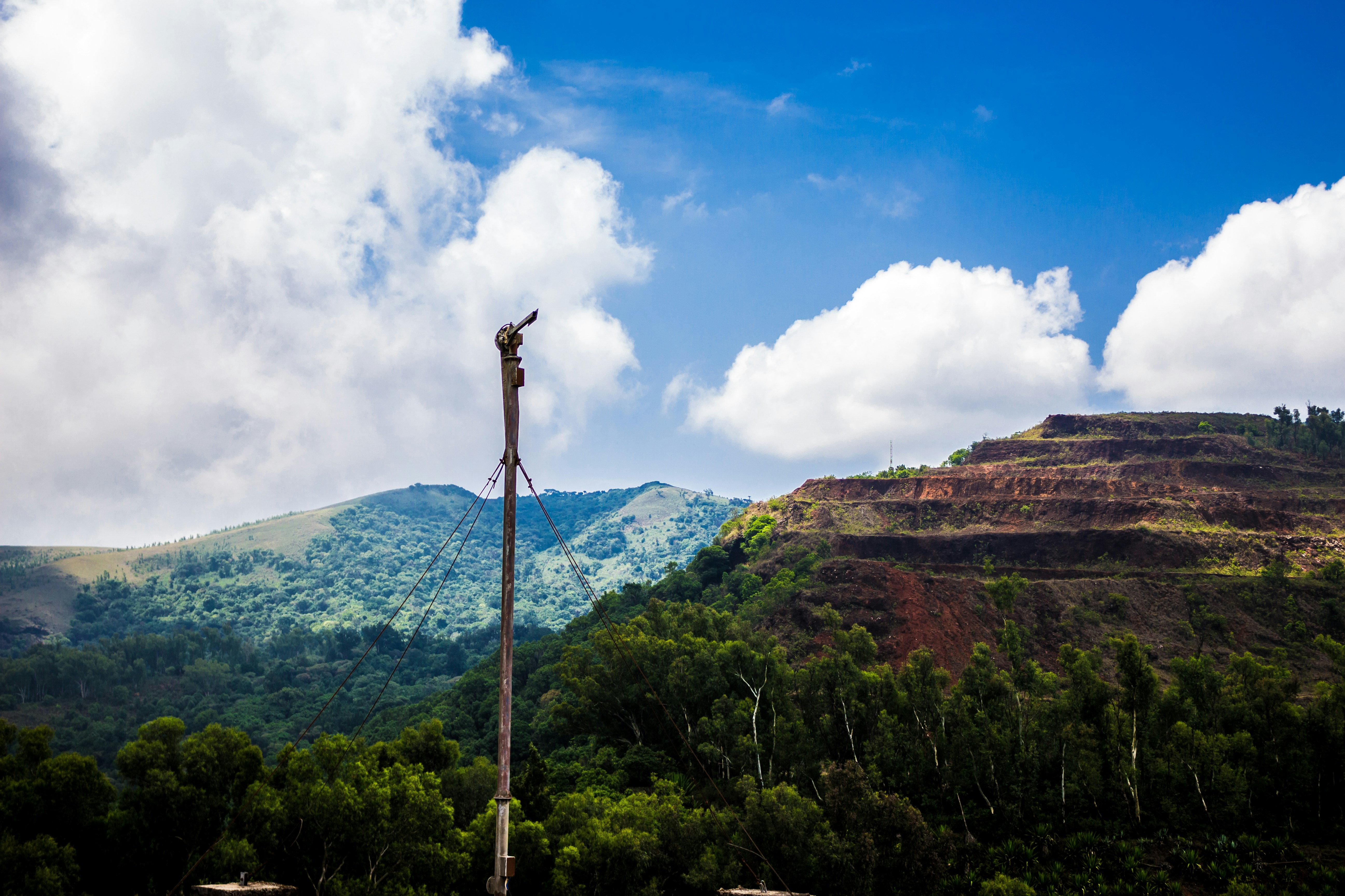 brown antenna near mountain