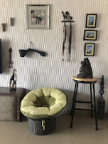 A cozy scene showing woven textiles draped over a rustic chair.