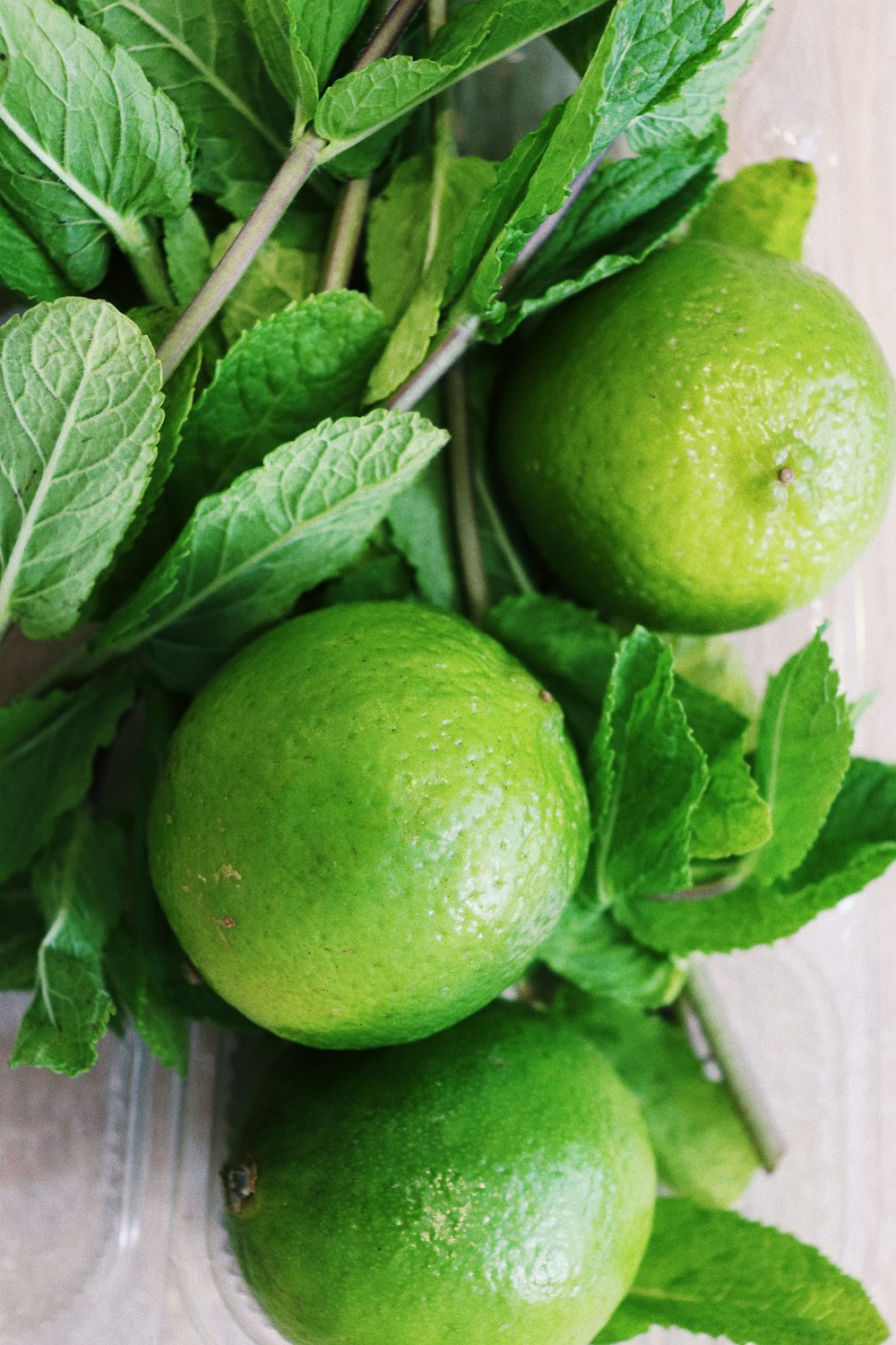 three round green fruits