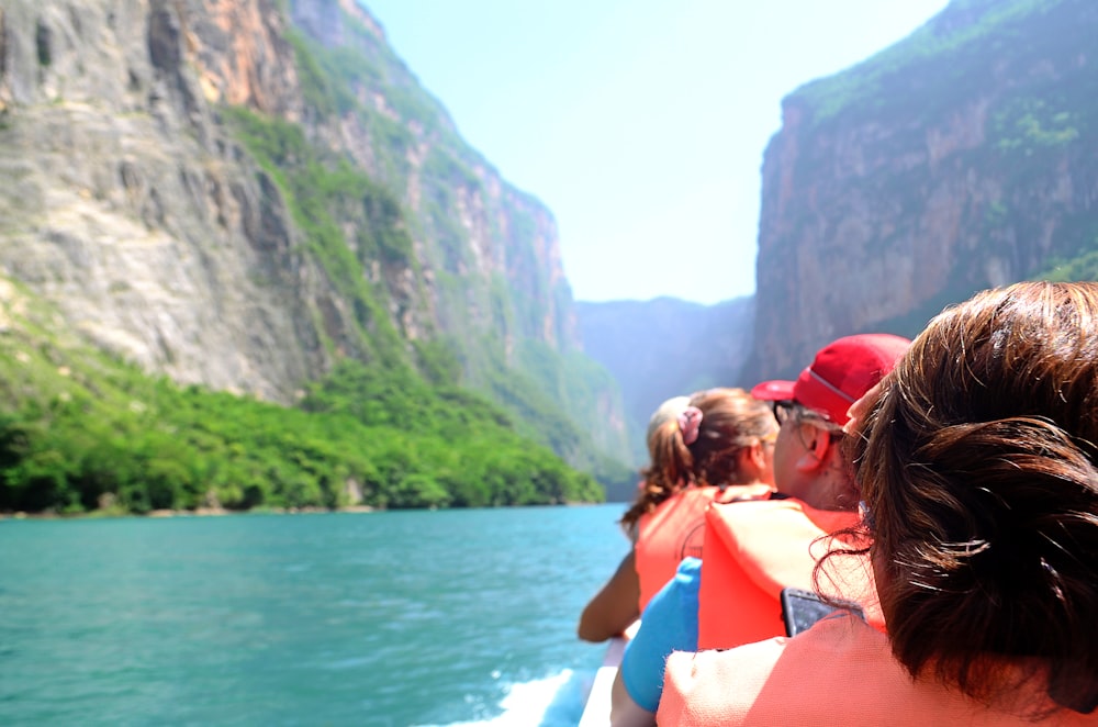 group of people riding boat