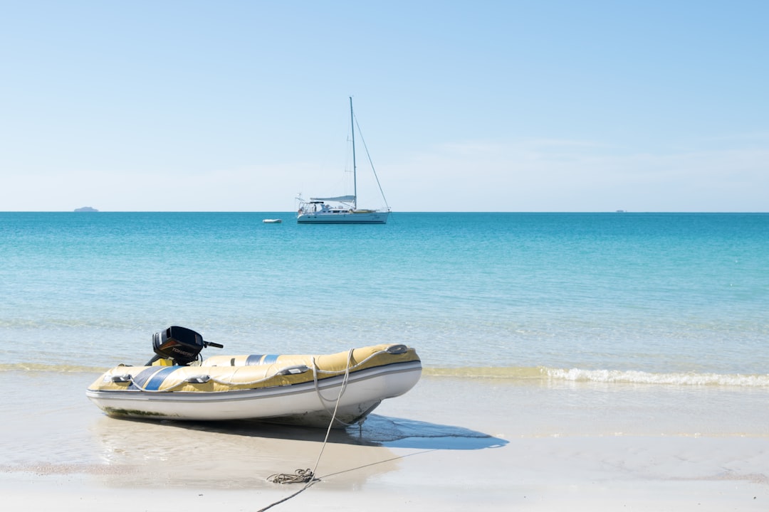 white raft on shore,