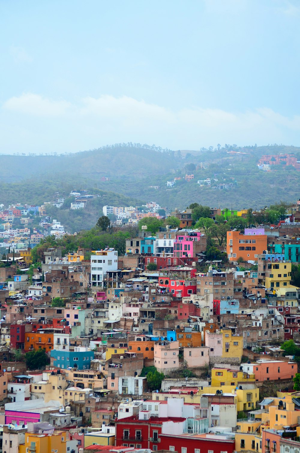 aerial photography of assorted-color buildings on top of mountain during daytime