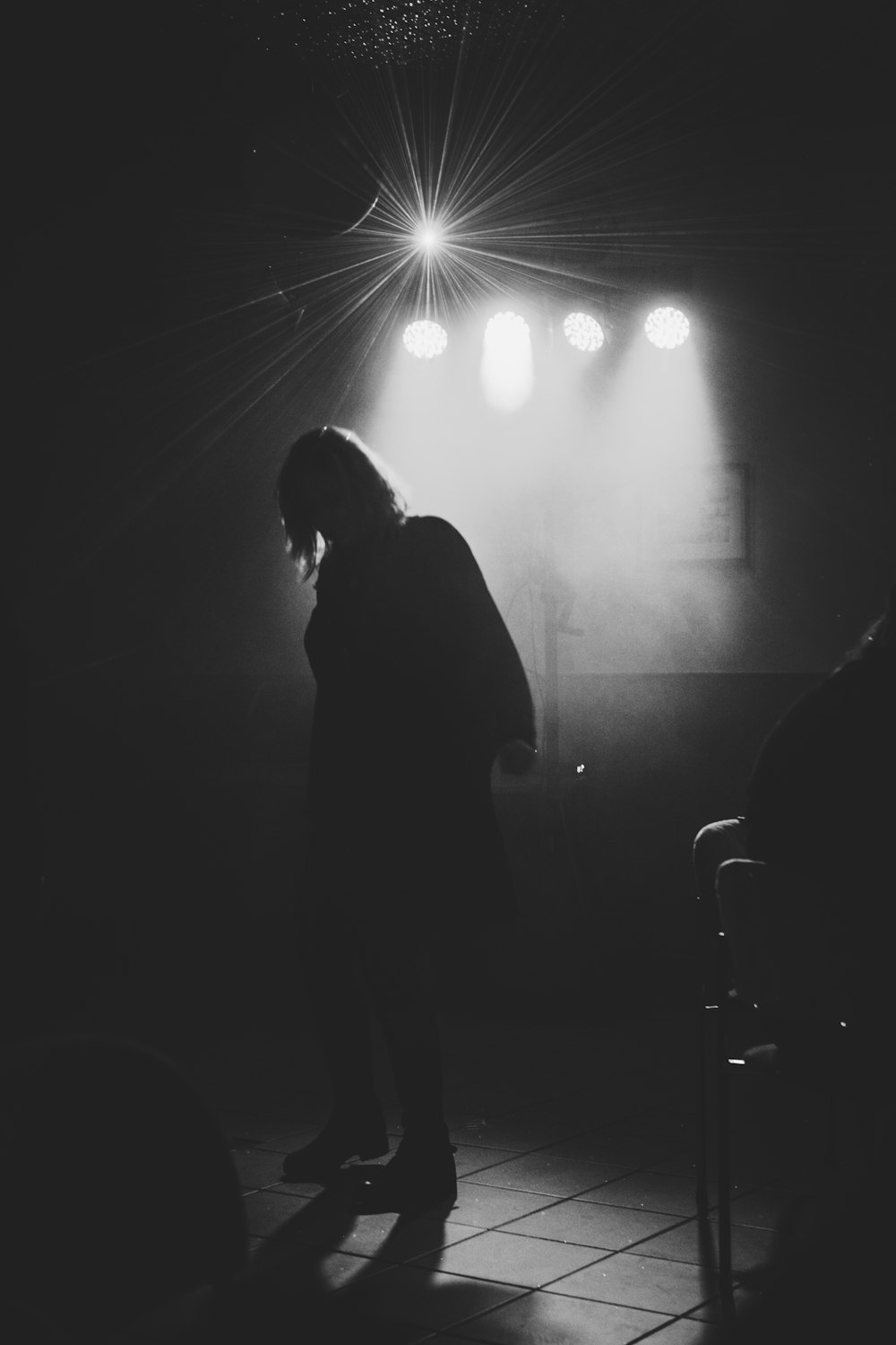 grey-scale photo of a person in a stage close-up photography