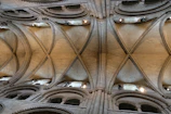 Detail of historic Roman vaulted ceiling with contemporary furniture below.