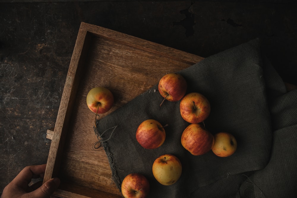 red apples on brown rack