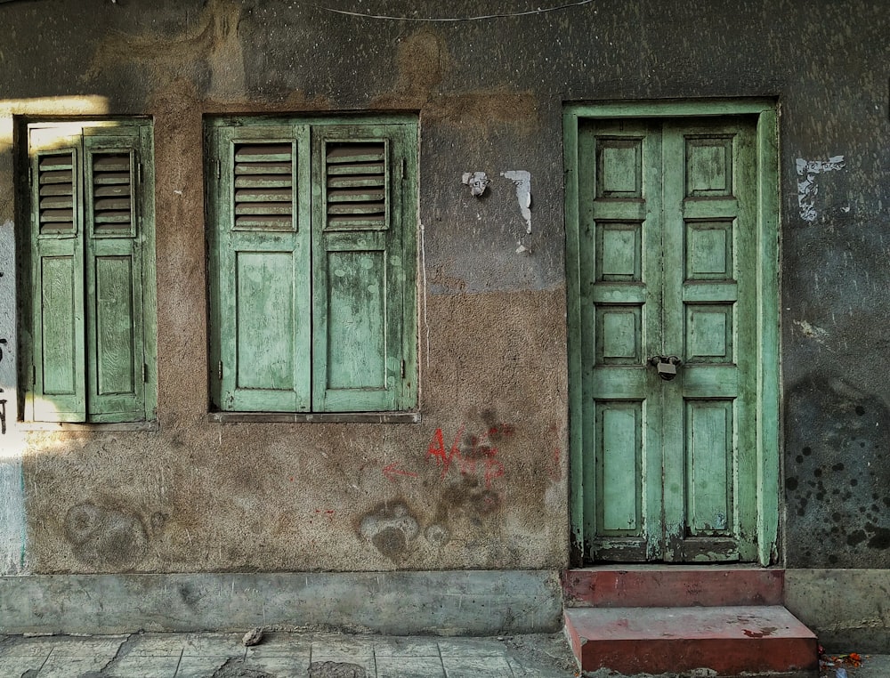 green wooden 8-panel door