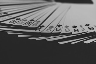 grayscale photo of a fanned playing card