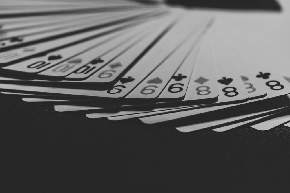 grayscale photo of a fanned playing card