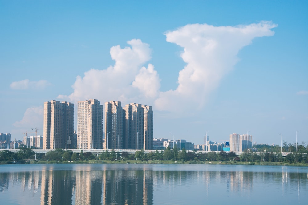 body of water across city buildings during daytime