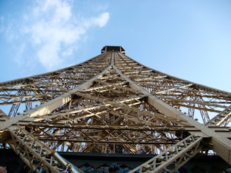 low angle photo of grey and brown metal tower