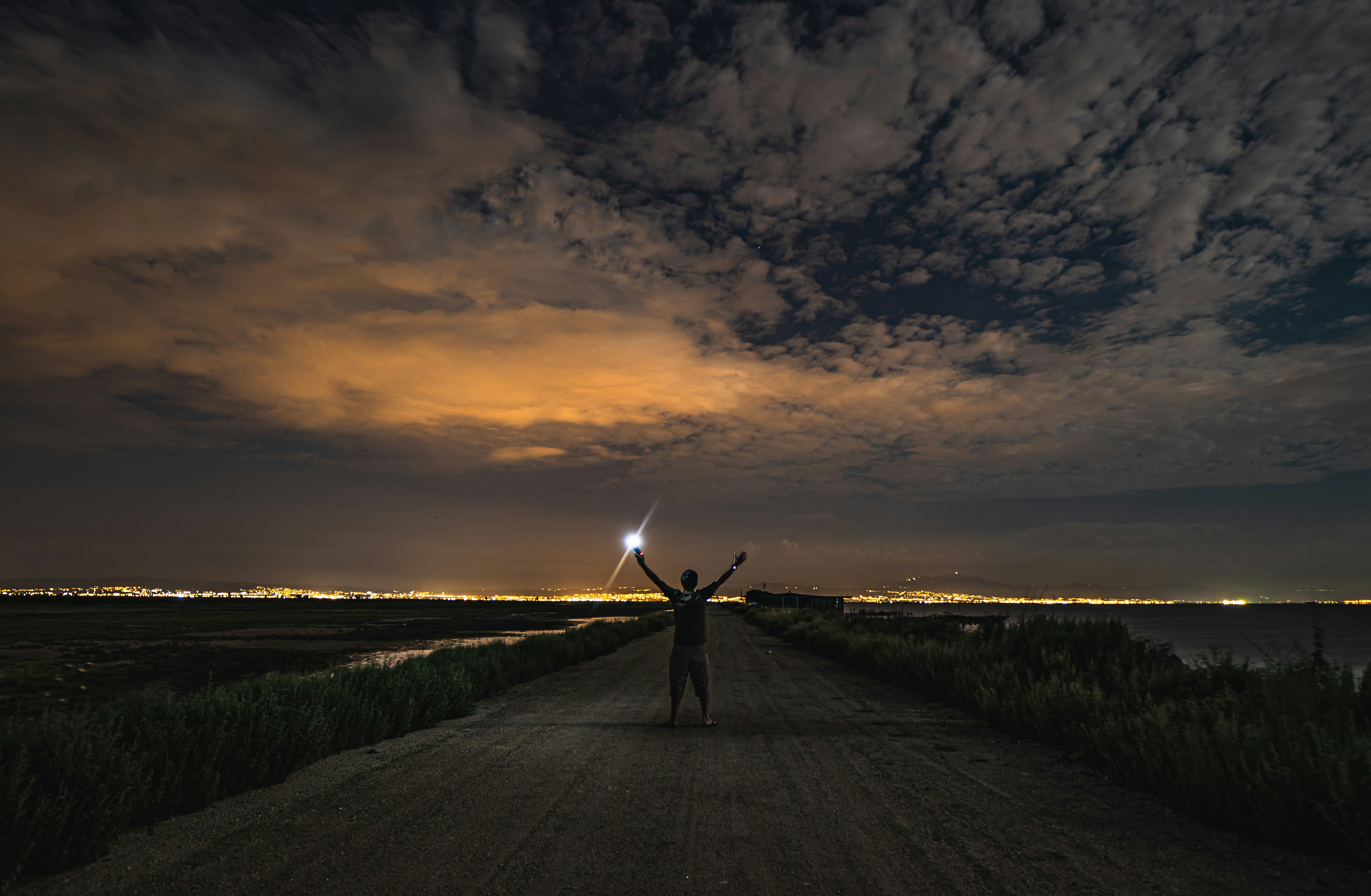 person standing across white clouds