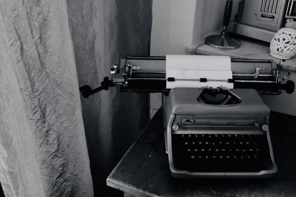 typewriter on desk near wall