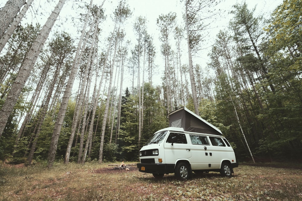 white camper trailer at the forest