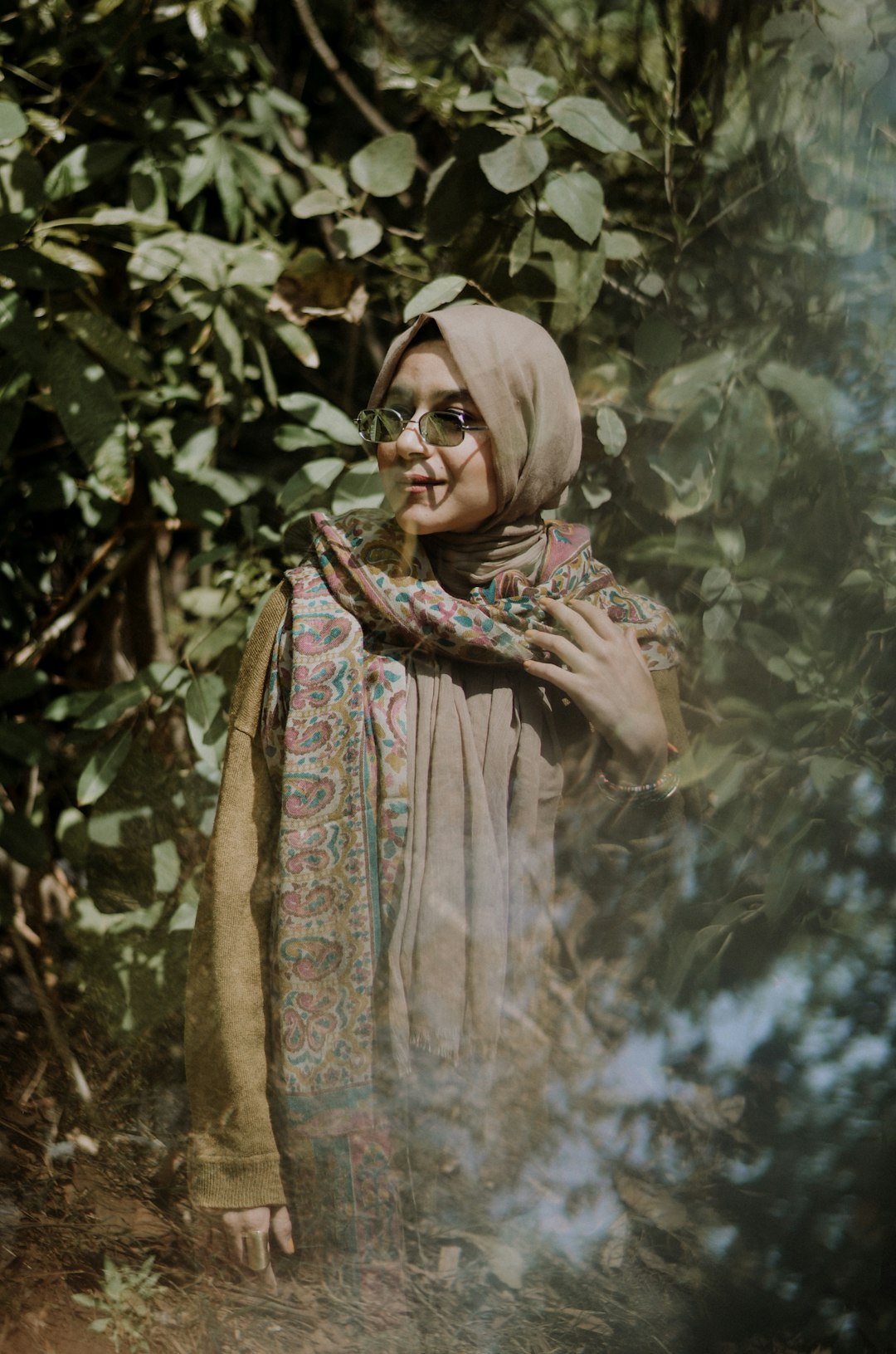 woman wearing hijab beside plants