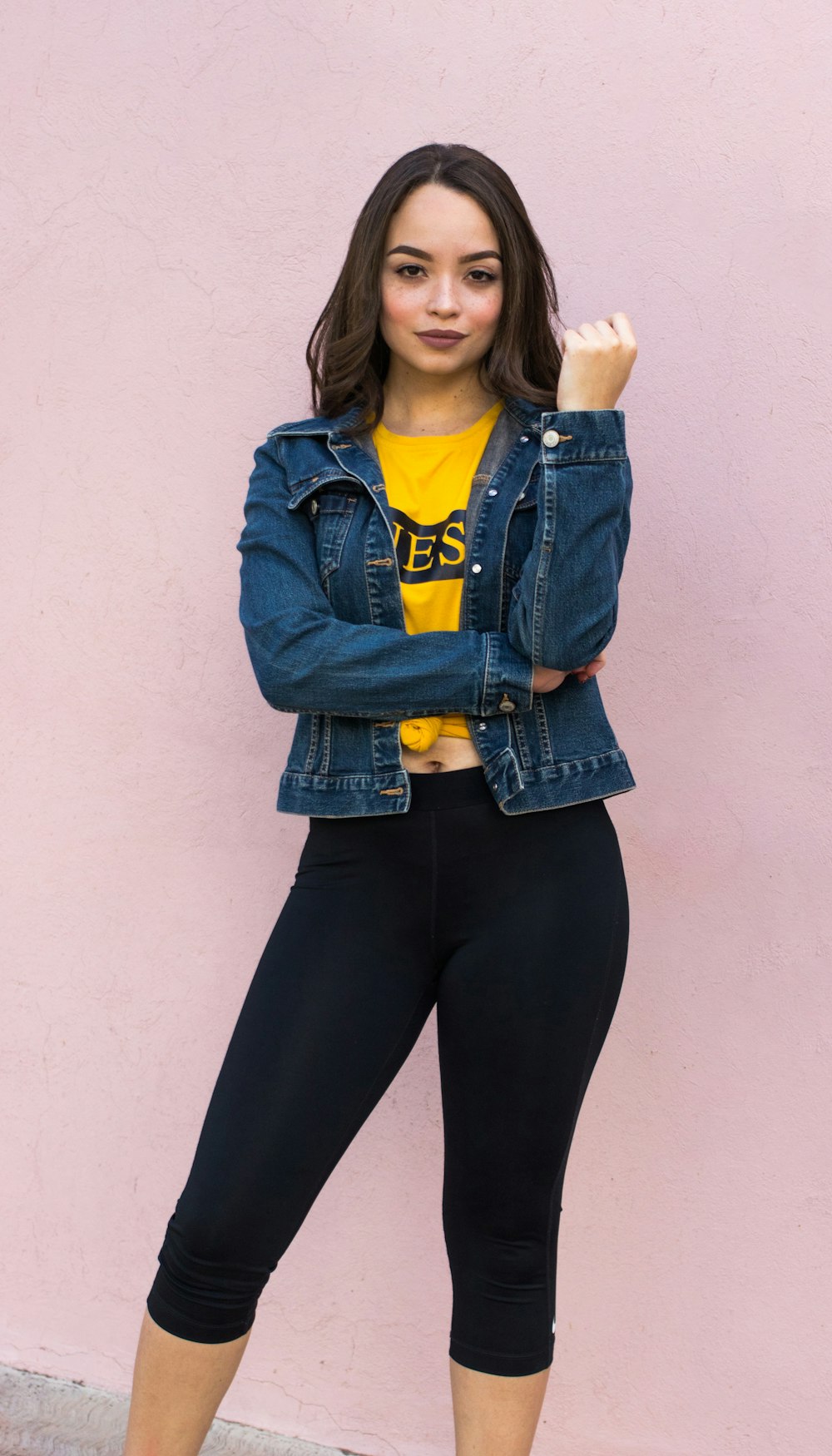 women's yellow crew-neck shirt and blue denim button-up jacket