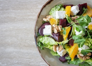 bowl of vegetable salad with walnuts