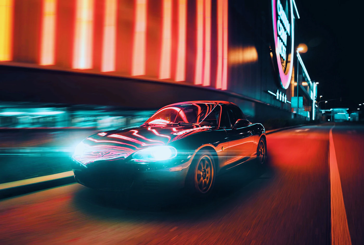 Japanese sports car at night, representing our authorized DENSO partnership