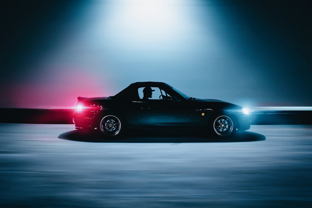 black coupe on road