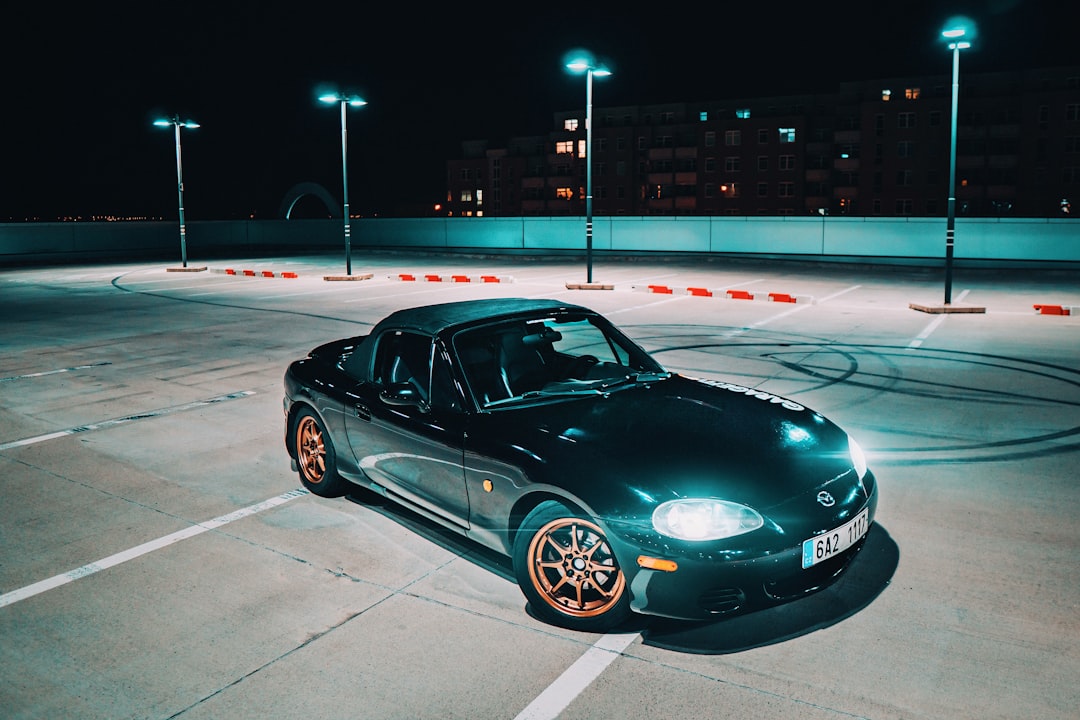 green Mazda Miata MX-5 on gray concrete floor, Mazda Miata MX5 - Night ride in city