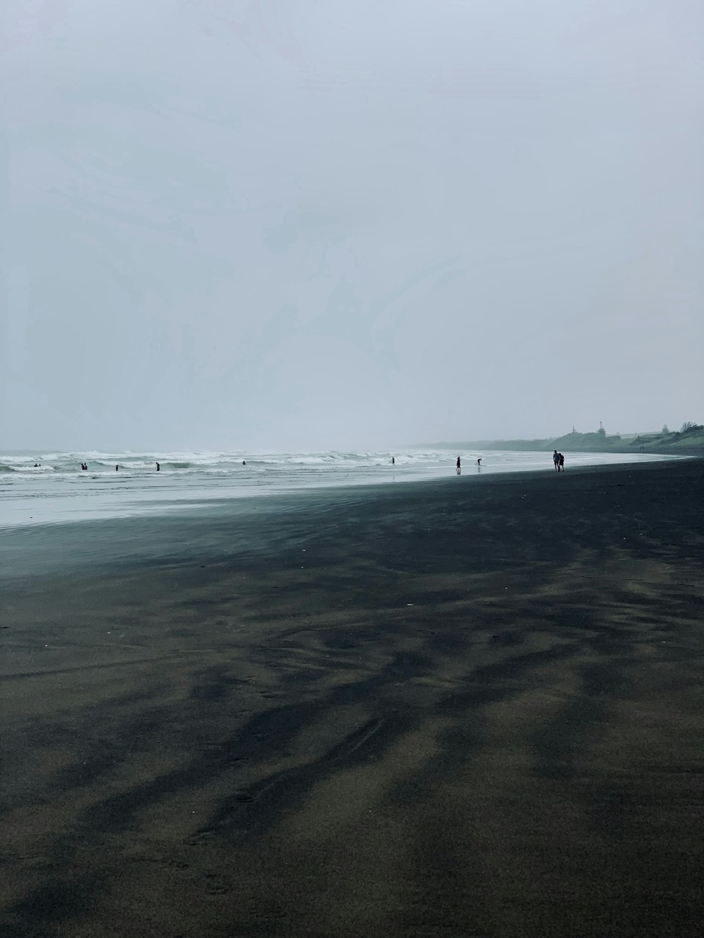 black sand dunes at the beach