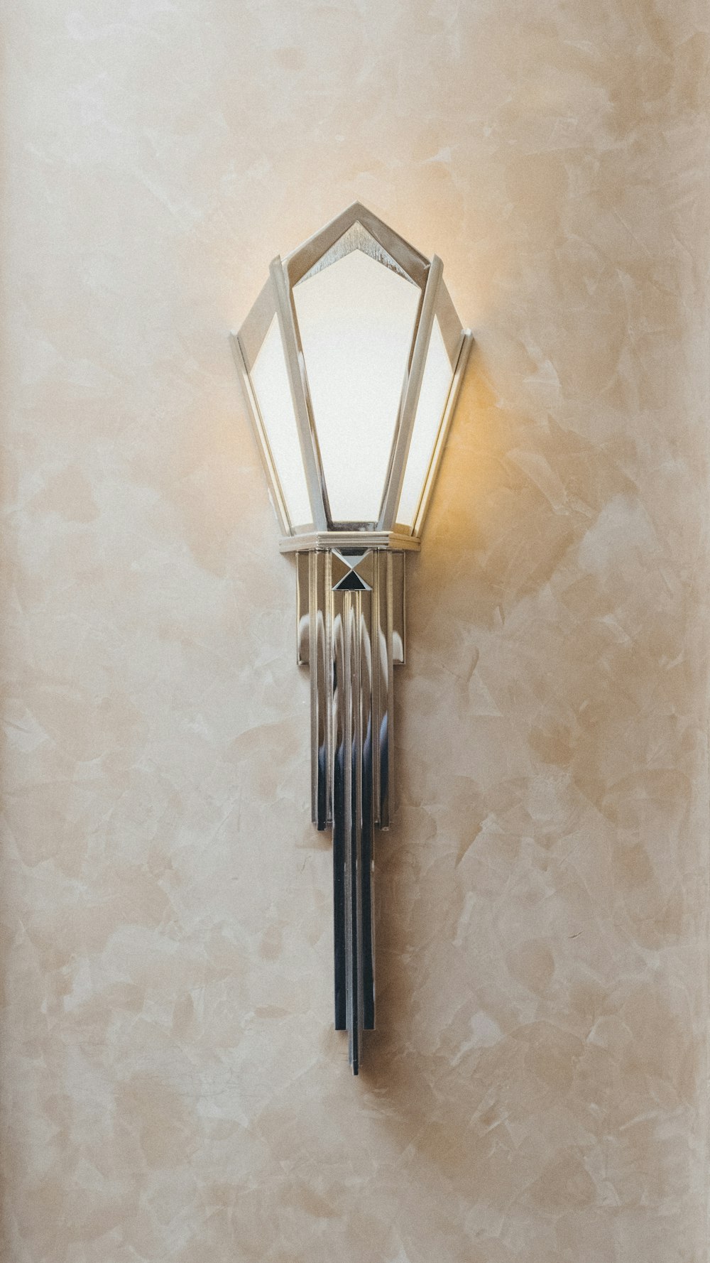 white and gray lamp sconce turned-on