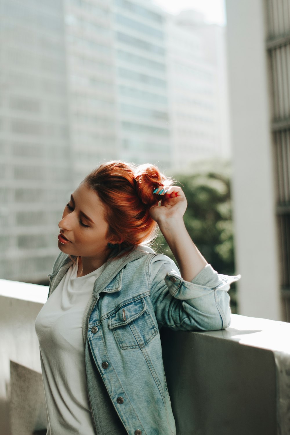 woman in blue denim jacket and white shirt