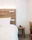 white bed pillow and white blanket on bed