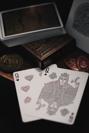 9 of hearts and Queen of clubs playing cards