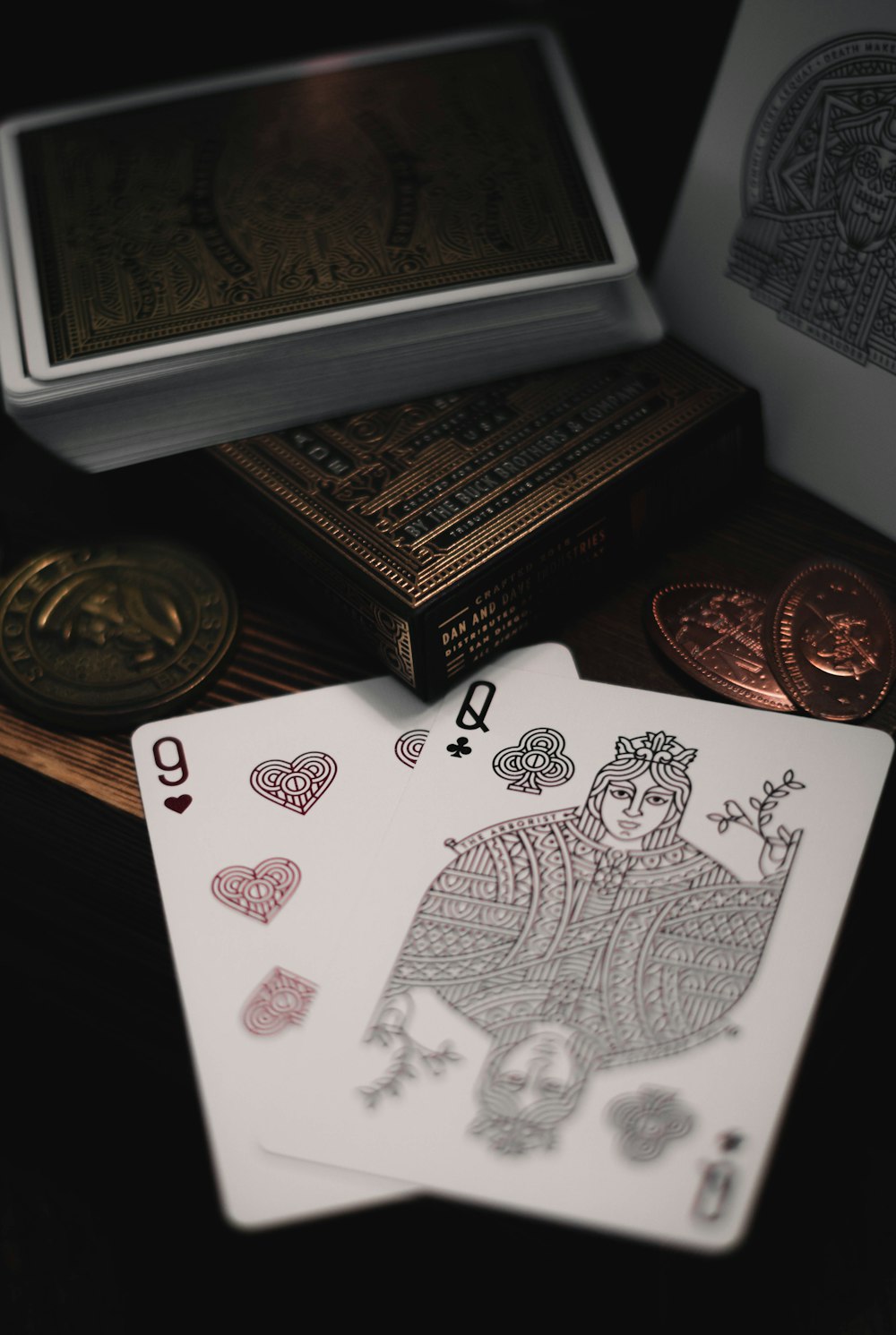9 of hearts and Queen of clubs playing cards