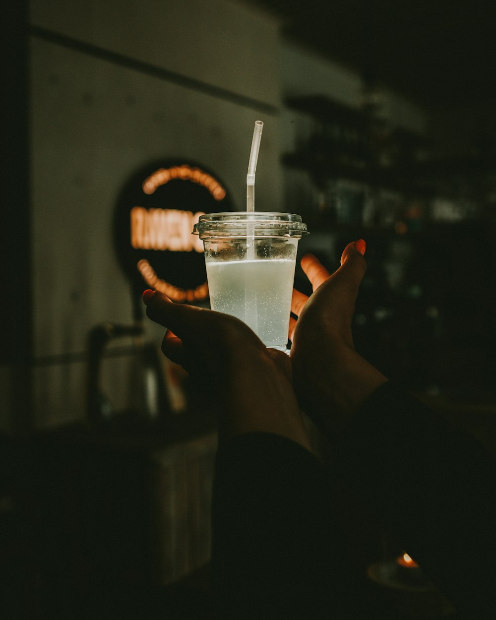 clear plastic disposable cup with white liquid