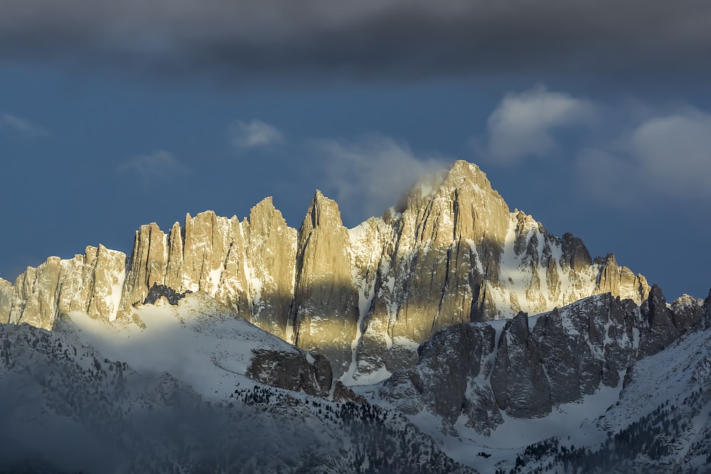 snow covered mountain during daytime