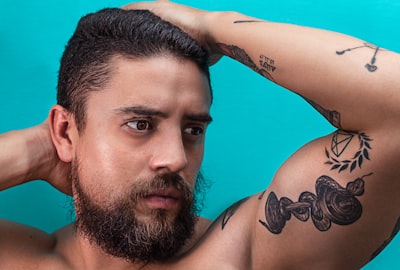 man's face tattoo google meet background