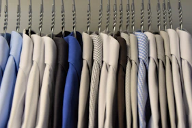assorted color dress shirt lot on clothes hangers