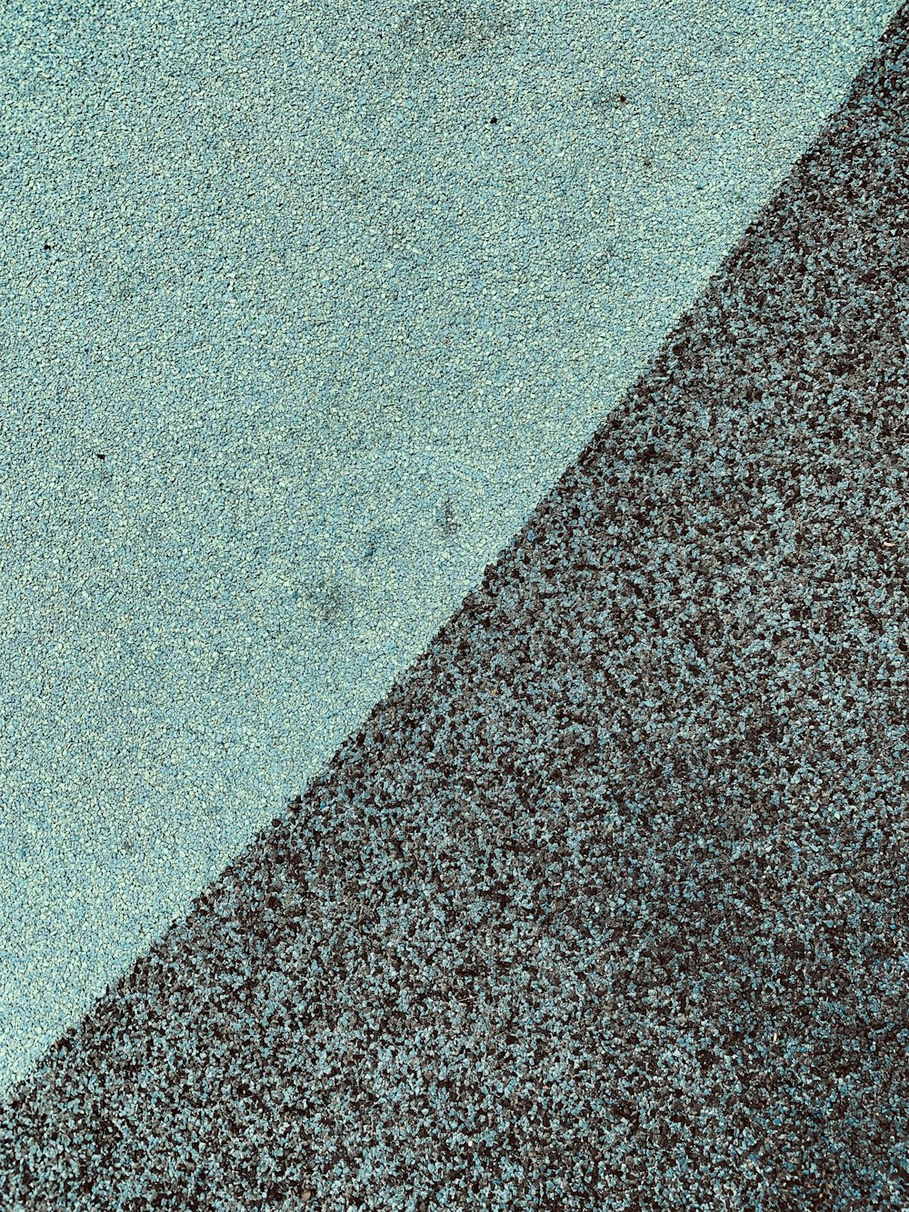 a close up of a blue and brown carpet