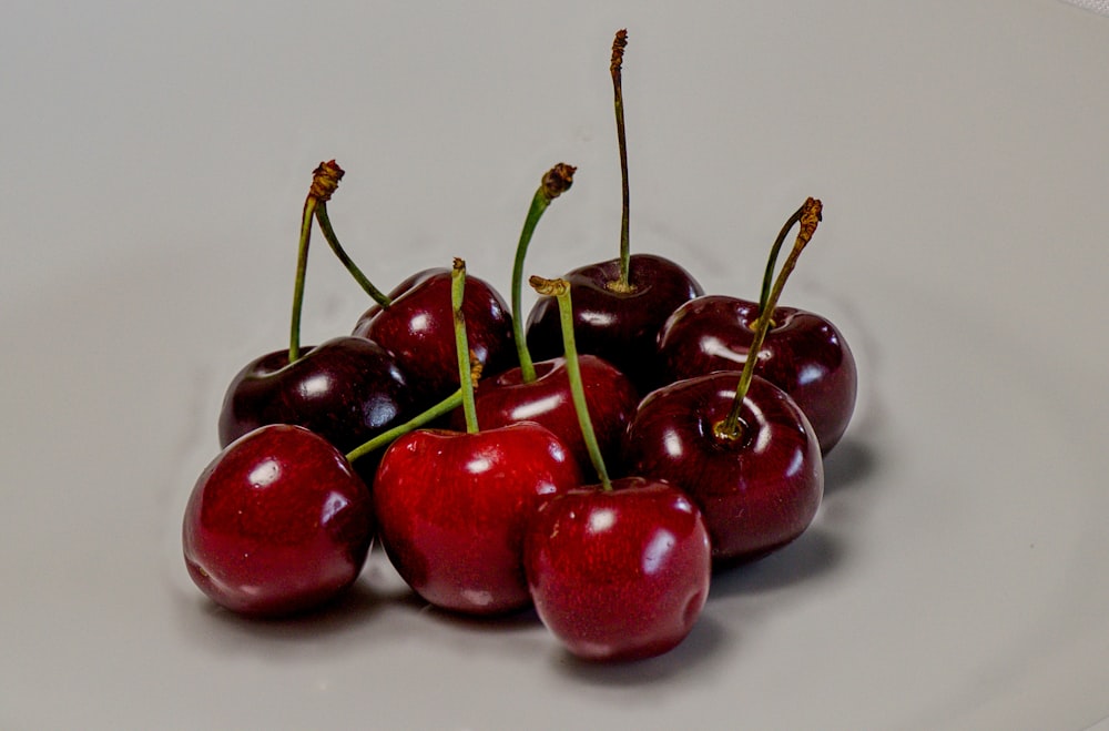 cherry fruits on white surface