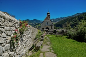 Peaceful countryside chapel surrounded by blooming spring flowers