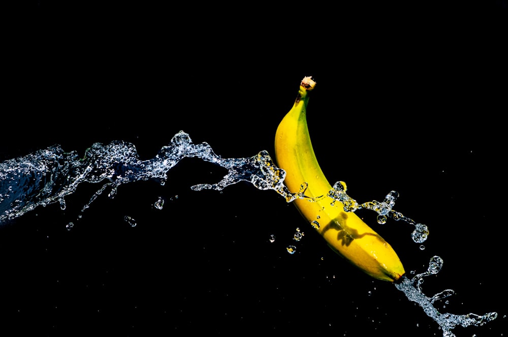 one yellow banana and water