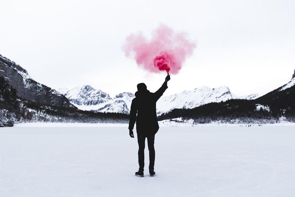 man holding pink powder