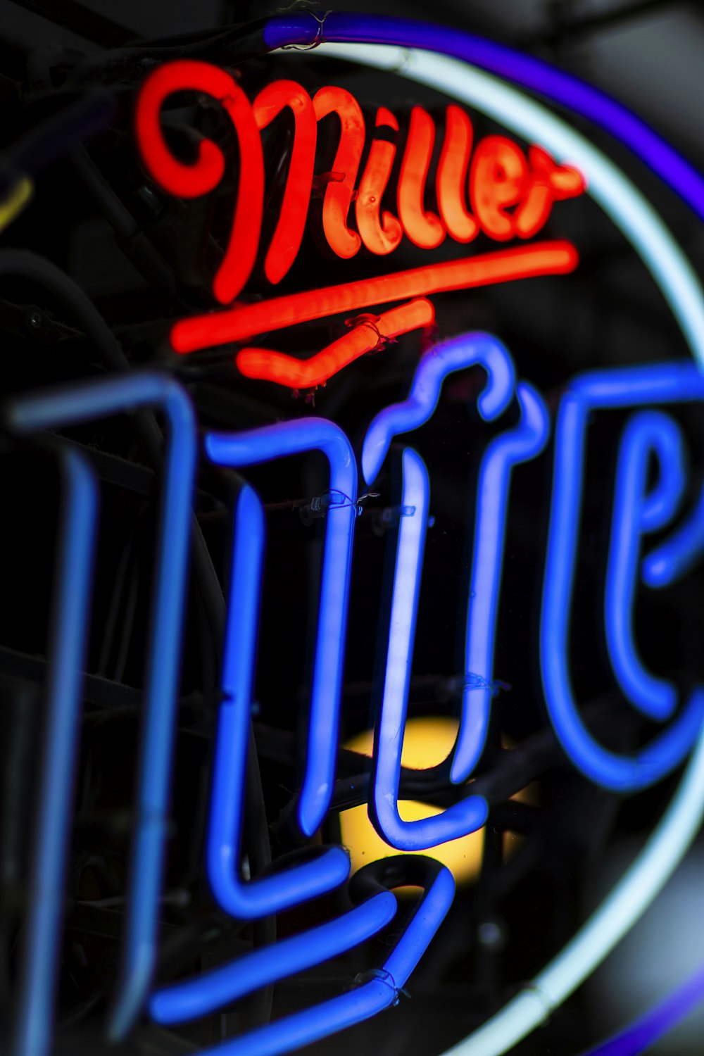 a neon sign that says miller lit up
