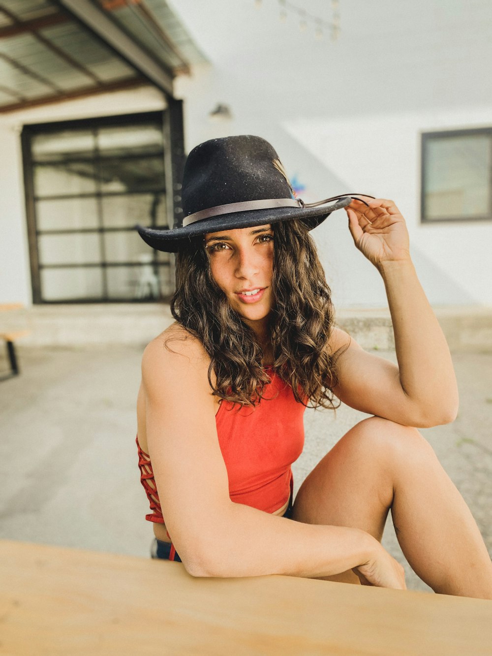 woman wearing a black cowboy hat