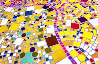 A vibrant mosaic made from various colorful geometric shapes