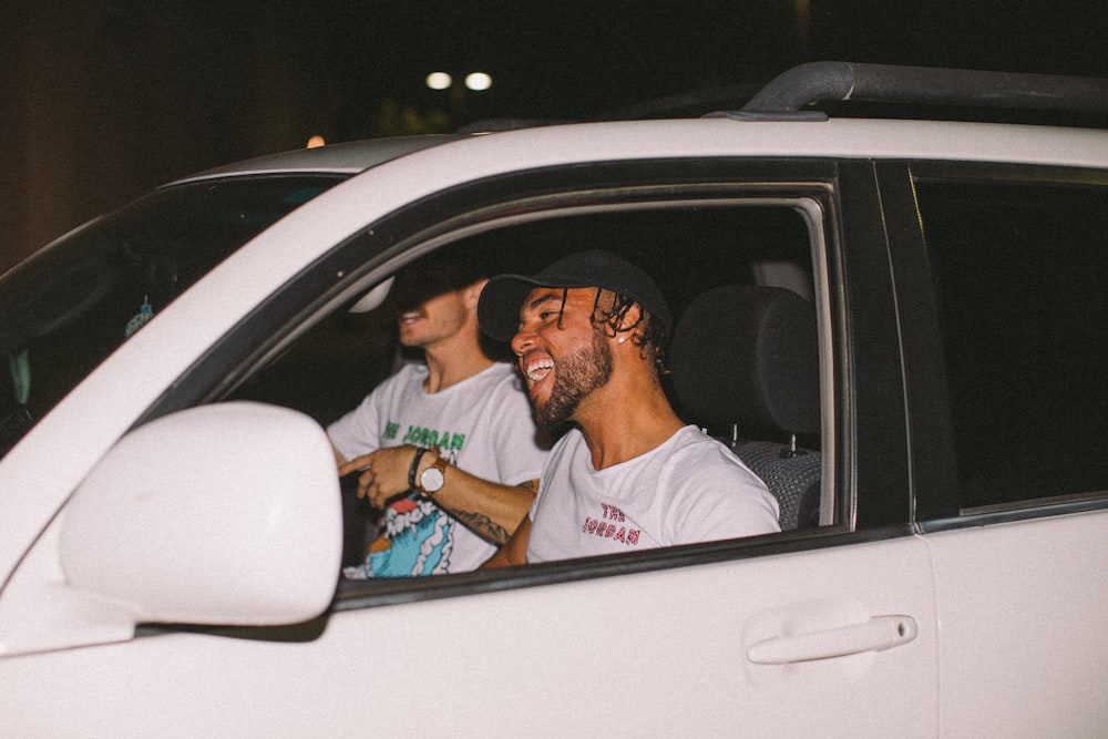 two men inside vehicle