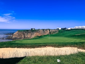 golf field near cliff overlooking ocean