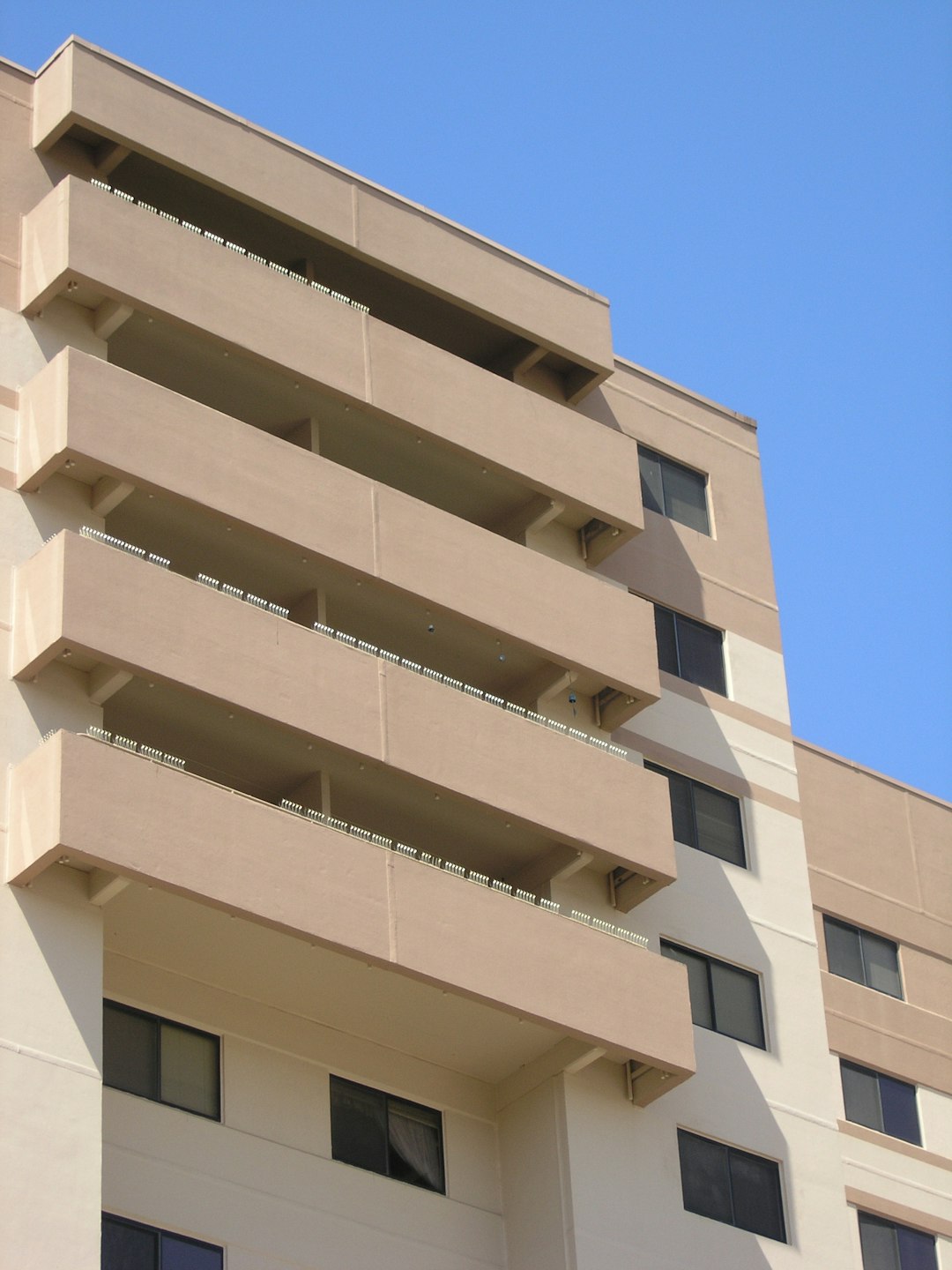  architectural photo of a beige building courtyard forecourt