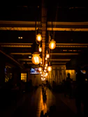 Evening event with warm lighting and guests enjoying the spacious, comfortable environment.