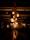 A cozy gathering with friends illuminated by ambient lighting.