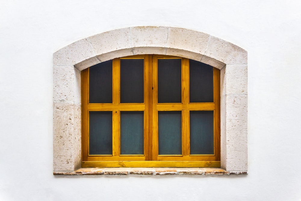 brown wooden framed glass window