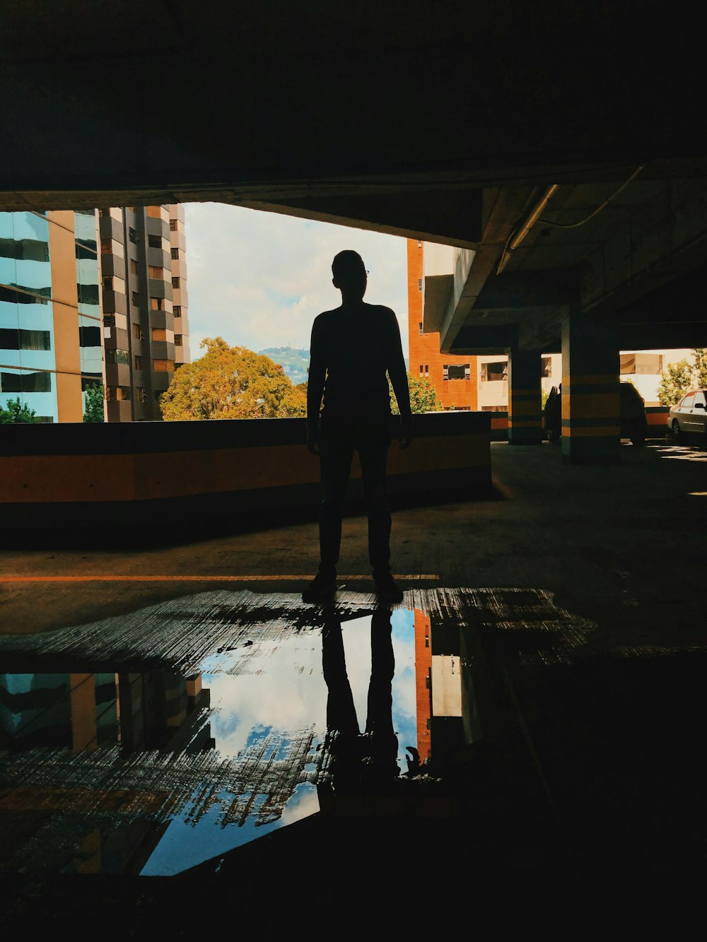 person standing near high-rise buildings